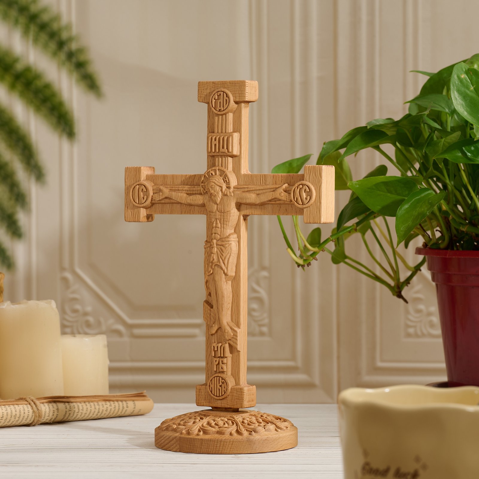 Angled view of Orthodox Jesus crucifix in natural wood showing carved Christ figure and traditional cross form