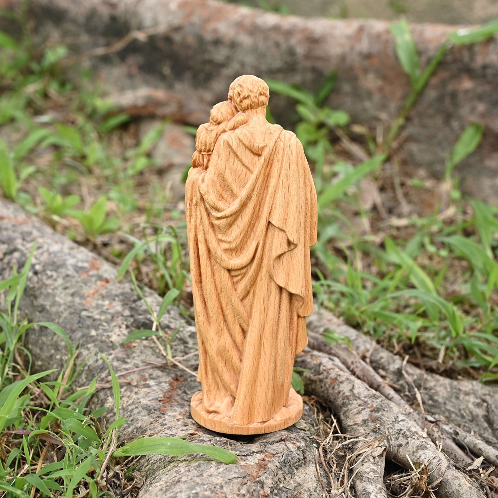 Back view of Saint Joseph wooden statue showing handmade carving details and natural wood texture