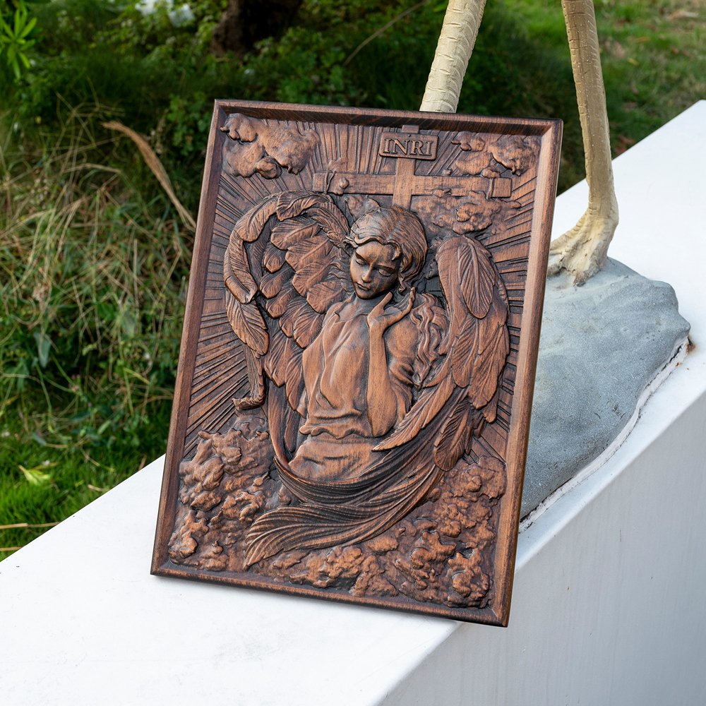 Female Angel wood relief displayed on a ledge, highlighting natural wood texture and carved angel details