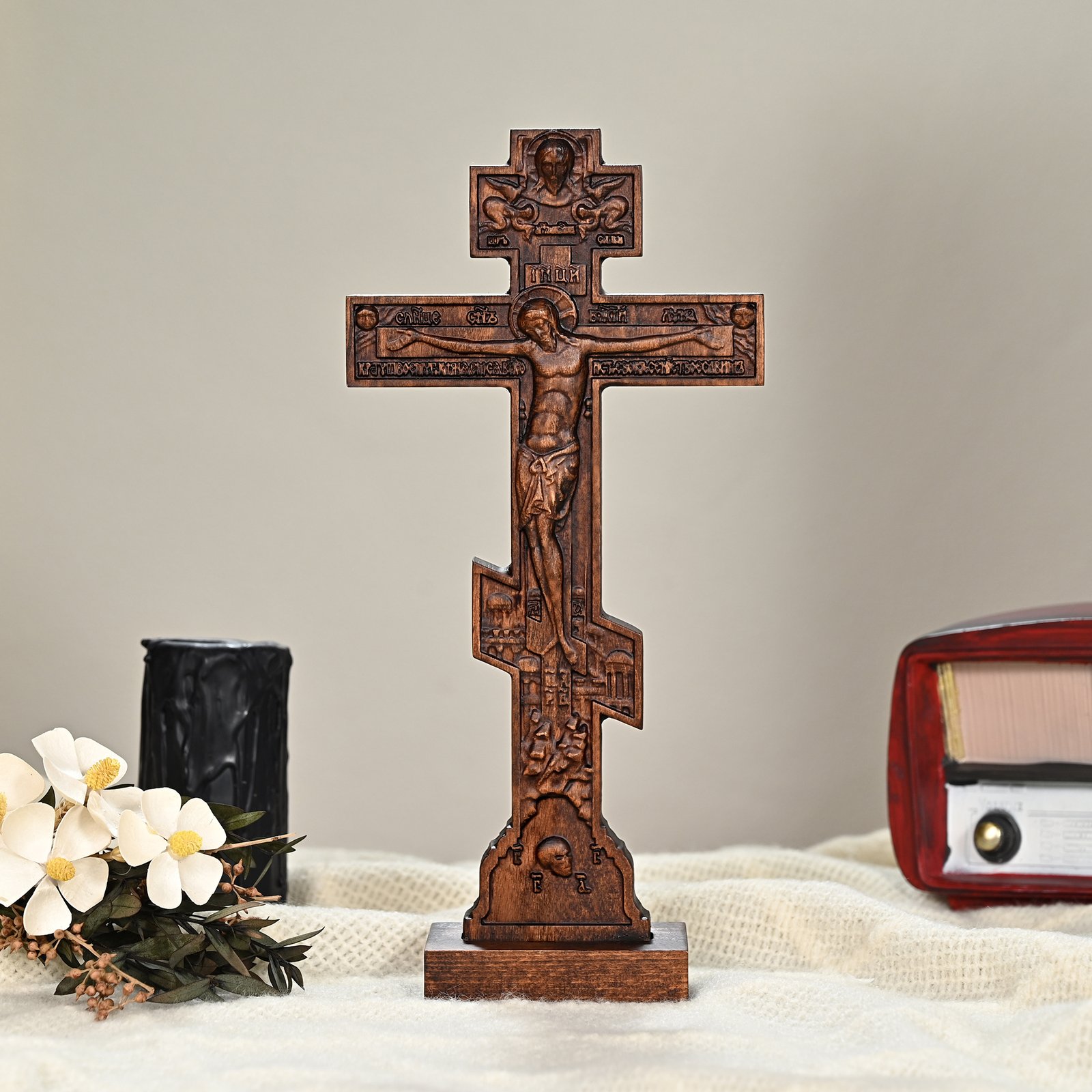 Orthodox Cross Stand used as Christian home decoration with flowers and religious objects