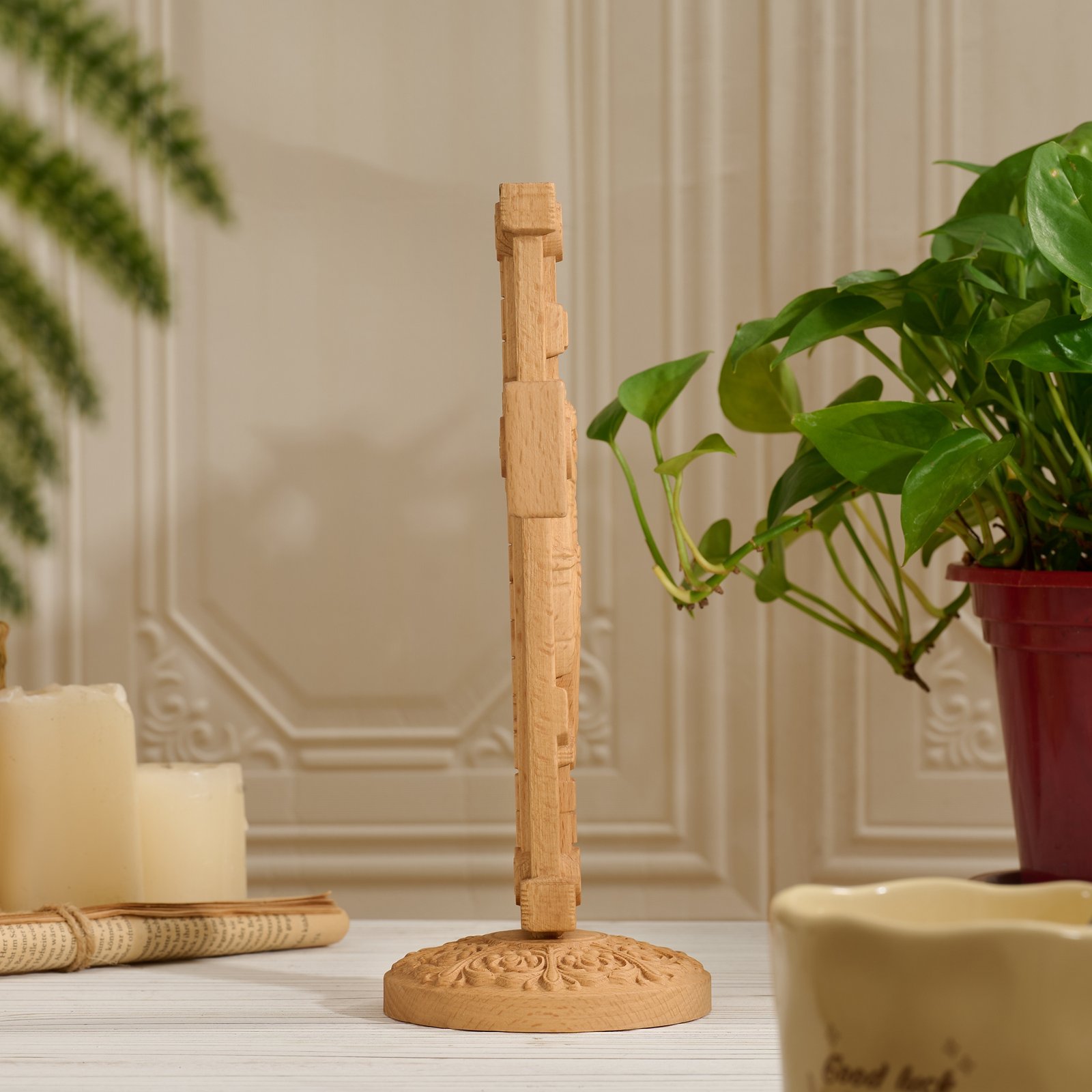 Side view of light wood Orthodox crucifix showing thickness, carved base and handcrafted wood structure