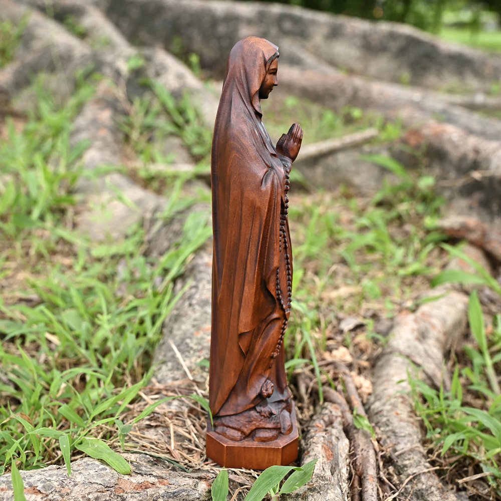Side view of Lourdes Virgin Mary statue showing the robe details and handmade sculpture craftsmanship