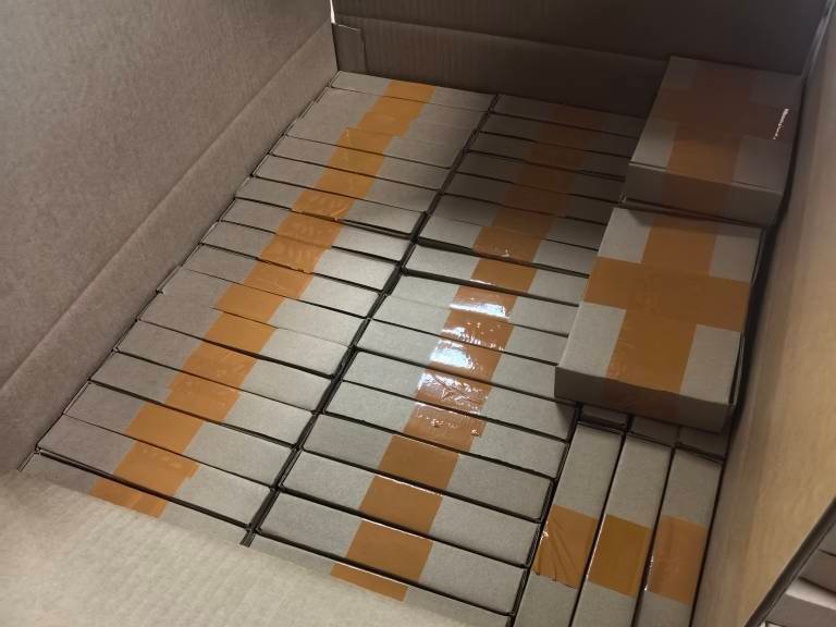 Individually boxed wood carvings arranged in a master carton for FBA delivery