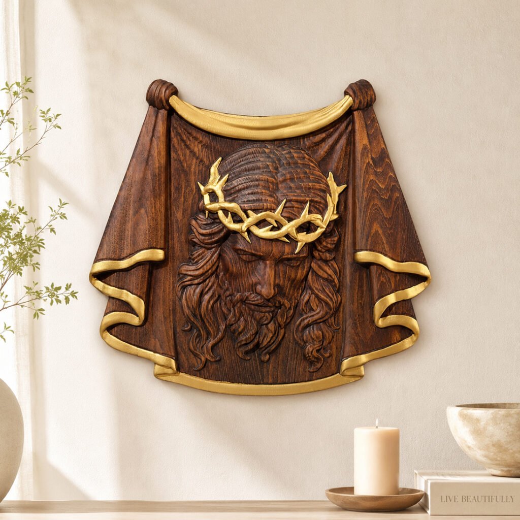 Antique gold Jesus face wood carving wall decor with gold crown of thorns and decorative trim displayed on a neutral wall