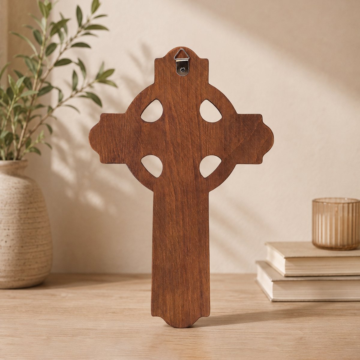 Back view of a wooden Celtic cross showing the smooth wood finish, open ring design and metal wall hanger