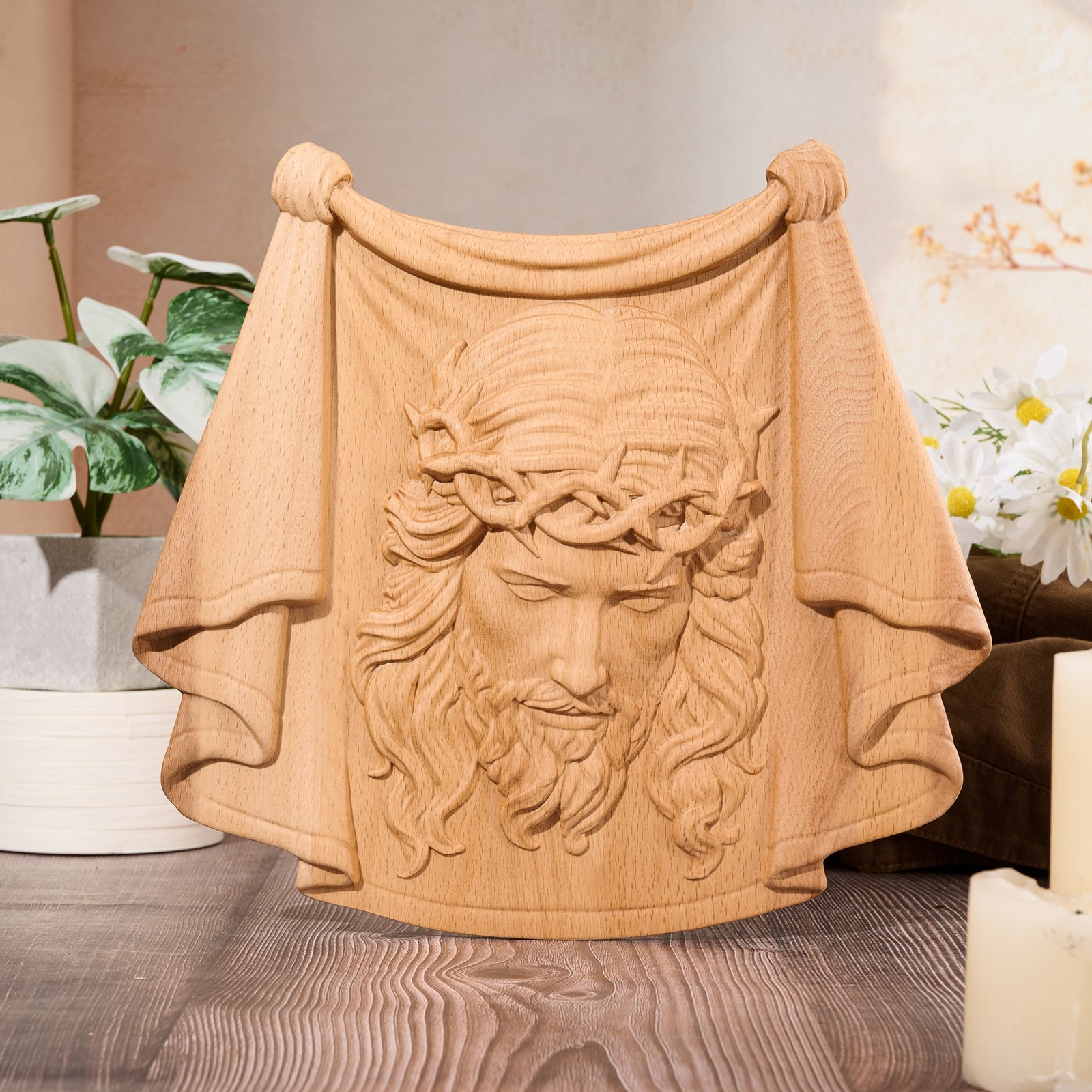 Natural wood Jesus face wall art with draped veil and crown of thorns, displayed in a light home decor setting